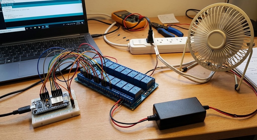 Complete system overview showing the NodeMCU wired to the 16-channel relay module, highlighting the opto-isolated connections and external power distribution.